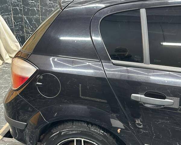 Черный Опель Астра, объемом двигателя 1.4 л и пробегом 219 тыс. км за 5000 $, фото 1 на Automoto.ua