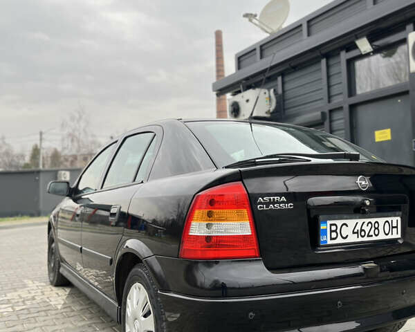 Черный Опель Астра, объемом двигателя 1.36 л и пробегом 82 тыс. км за 4000 $, фото 6 на Automoto.ua