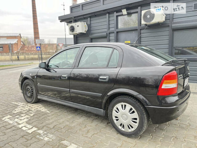 Черный Опель Астра, объемом двигателя 1.36 л и пробегом 82 тыс. км за 4000 $, фото 7 на Automoto.ua