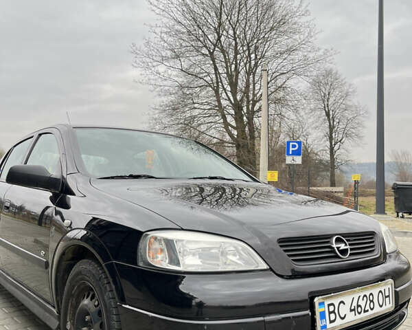 Черный Опель Астра, объемом двигателя 1.36 л и пробегом 82 тыс. км за 4000 $, фото 2 на Automoto.ua