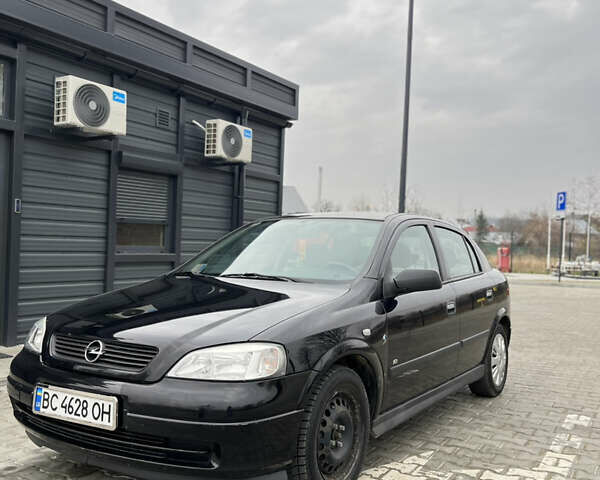 Черный Опель Астра, объемом двигателя 1.36 л и пробегом 82 тыс. км за 4000 $, фото 1 на Automoto.ua