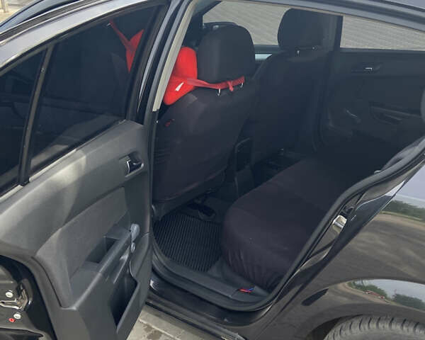 Черный Опель Астра, объемом двигателя 1.6 л и пробегом 170 тыс. км за 5150 $, фото 6 на Automoto.ua