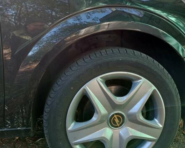 Черный Опель Астра, объемом двигателя 1.6 л и пробегом 140 тыс. км за 6100 $, фото 6 на Automoto.ua