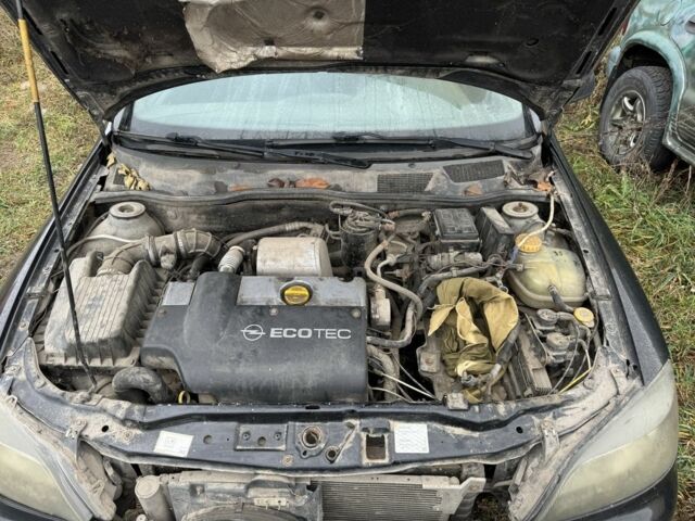 Черный Опель Астра, объемом двигателя 2 л и пробегом 222 тыс. км за 750 $, фото 6 на Automoto.ua