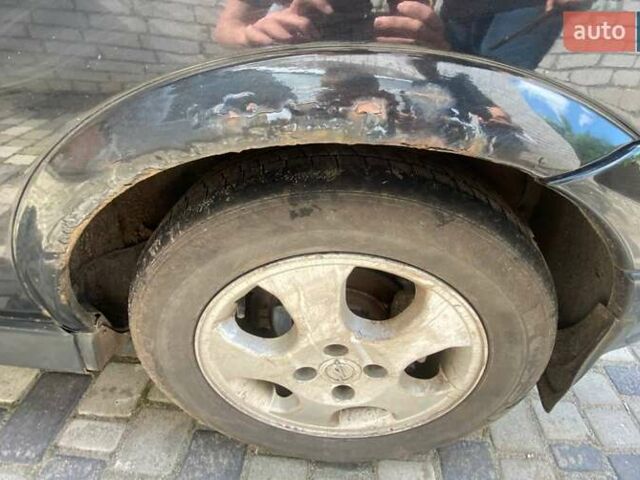 Чорний Опель Астра, об'ємом двигуна 1.6 л та пробігом 346 тис. км за 2300 $, фото 5 на Automoto.ua