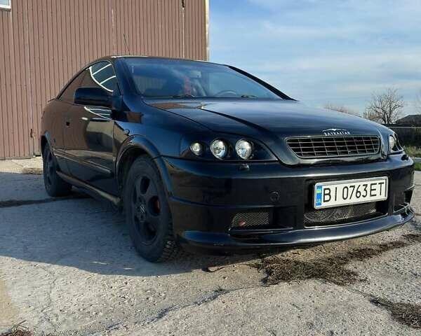 Черный Опель Астра, объемом двигателя 2.2 л и пробегом 297 тыс. км за 3700 $, фото 1 на Automoto.ua