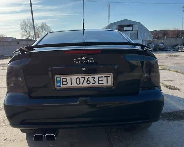 Черный Опель Астра, объемом двигателя 2.2 л и пробегом 297 тыс. км за 3700 $, фото 2 на Automoto.ua
