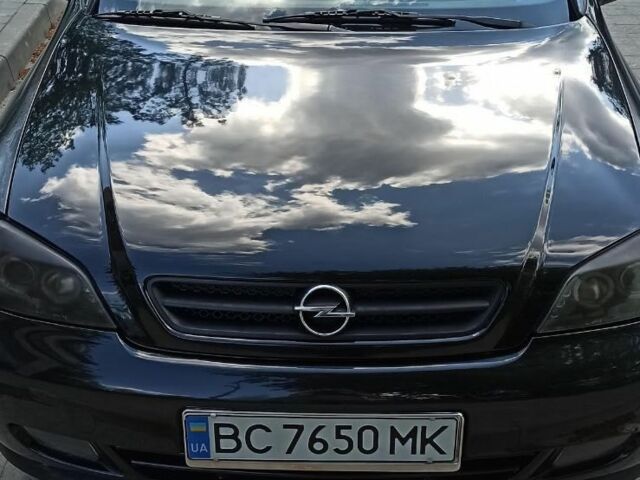Черный Опель Астра, объемом двигателя 2.2 л и пробегом 285 тыс. км за 2950 $, фото 3 на Automoto.ua
