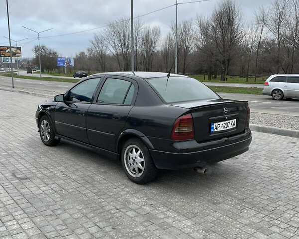 Черный Опель Астра, объемом двигателя 1.6 л и пробегом 205 тыс. км за 1999 $, фото 2 на Automoto.ua