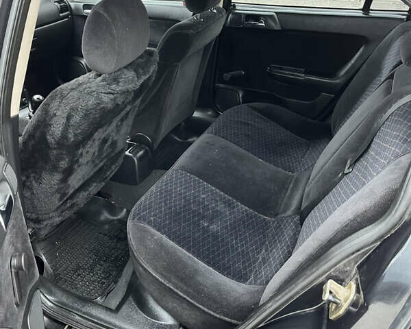 Черный Опель Астра, объемом двигателя 1.6 л и пробегом 205 тыс. км за 1999 $, фото 9 на Automoto.ua