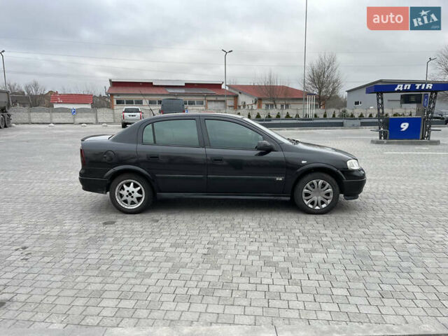 Черный Опель Астра, объемом двигателя 1.6 л и пробегом 205 тыс. км за 1999 $, фото 5 на Automoto.ua