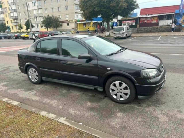 Черный Опель Астра, объемом двигателя 1.6 л и пробегом 290 тыс. км за 3000 $, фото 7 на Automoto.ua