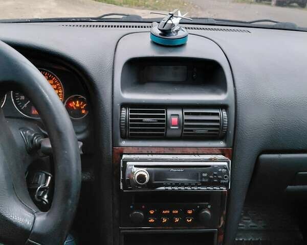 Черный Опель Астра, объемом двигателя 2 л и пробегом 350 тыс. км за 3199 $, фото 9 на Automoto.ua