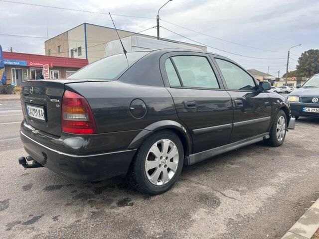 Черный Опель Астра, объемом двигателя 1.6 л и пробегом 290 тыс. км за 3000 $, фото 6 на Automoto.ua