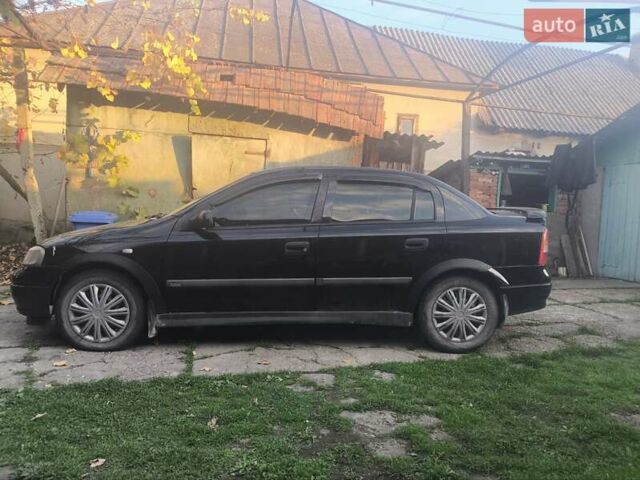 Черный Опель Астра, объемом двигателя 1.4 л и пробегом 250 тыс. км за 1800 $, фото 5 на Automoto.ua