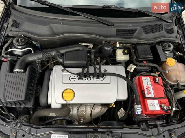 Черный Опель Астра, объемом двигателя 1.4 л и пробегом 205 тыс. км за 3800 $, фото 25 на Automoto.ua