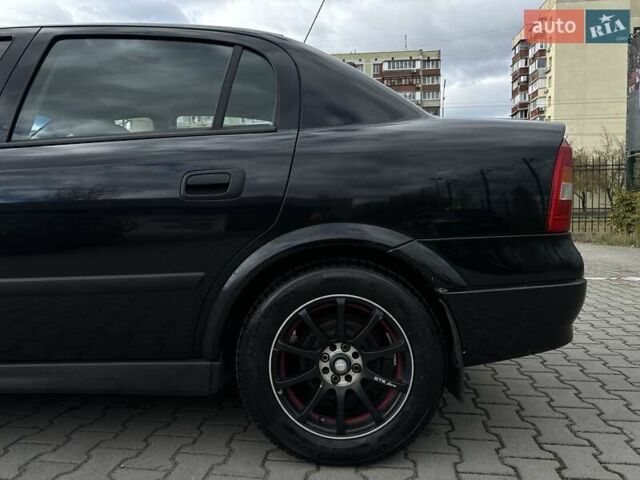 Черный Опель Астра, объемом двигателя 1.4 л и пробегом 205 тыс. км за 3800 $, фото 12 на Automoto.ua