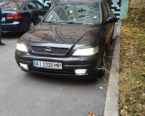 Черный Опель Астра, объемом двигателя 1.6 л и пробегом 274 тыс. км за 3500 $, фото 4 на Automoto.ua