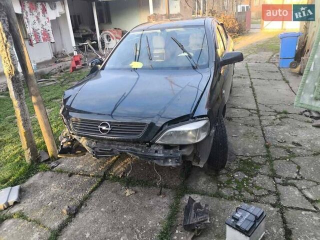 Черный Опель Астра, объемом двигателя 1.4 л и пробегом 200 тыс. км за 800 $, фото 1 на Automoto.ua
