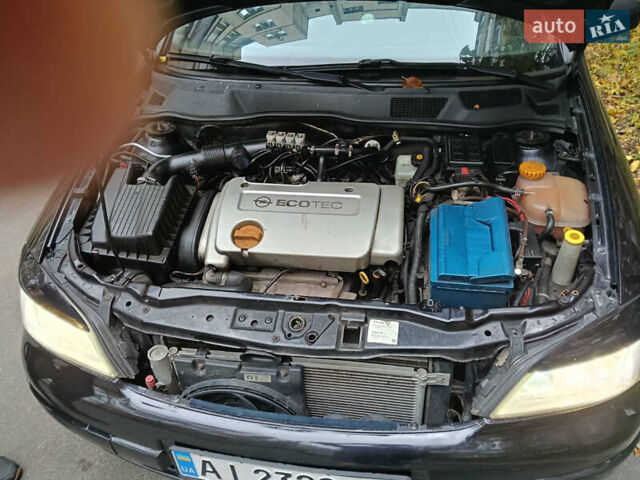 Черный Опель Астра, объемом двигателя 1.6 л и пробегом 274 тыс. км за 3500 $, фото 2 на Automoto.ua