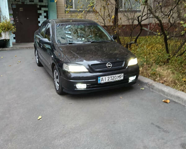 Черный Опель Астра, объемом двигателя 1.6 л и пробегом 274 тыс. км за 3500 $, фото 6 на Automoto.ua