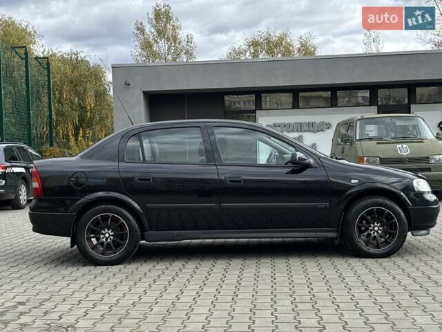 Черный Опель Астра, объемом двигателя 1.4 л и пробегом 205 тыс. км за 3800 $, фото 5 на Automoto.ua