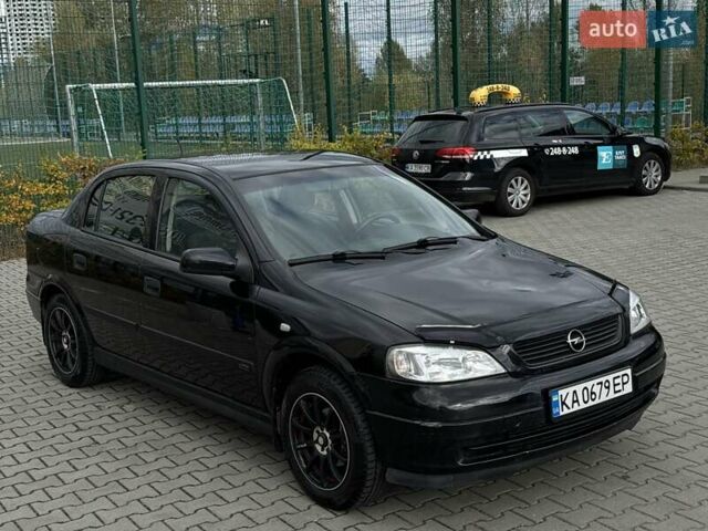 Черный Опель Астра, объемом двигателя 1.4 л и пробегом 205 тыс. км за 3800 $, фото 6 на Automoto.ua