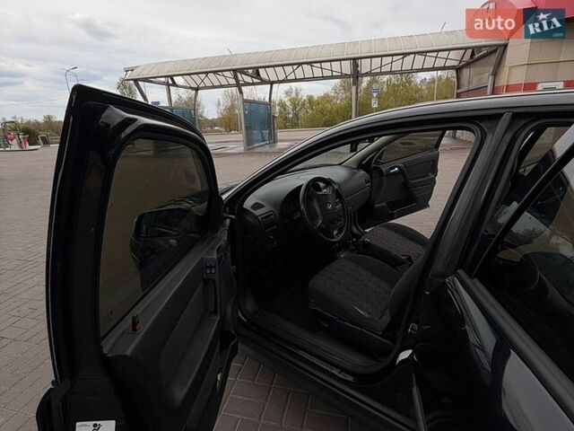 Черный Опель Астра, объемом двигателя 1.4 л и пробегом 285 тыс. км за 2400 $, фото 23 на Automoto.ua