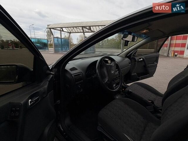 Черный Опель Астра, объемом двигателя 1.4 л и пробегом 285 тыс. км за 2400 $, фото 24 на Automoto.ua