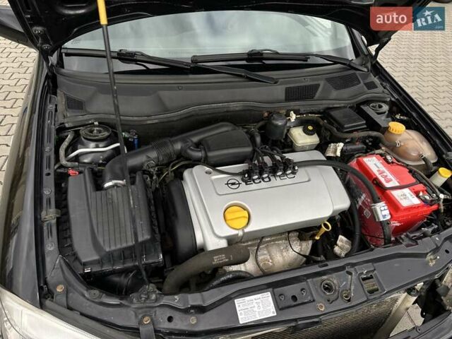 Черный Опель Астра, объемом двигателя 1.4 л и пробегом 205 тыс. км за 3800 $, фото 24 на Automoto.ua