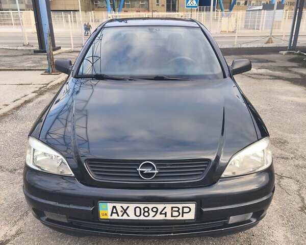 Черный Опель Астра, объемом двигателя 1.4 л и пробегом 217 тыс. км за 2900 $, фото 2 на Automoto.ua