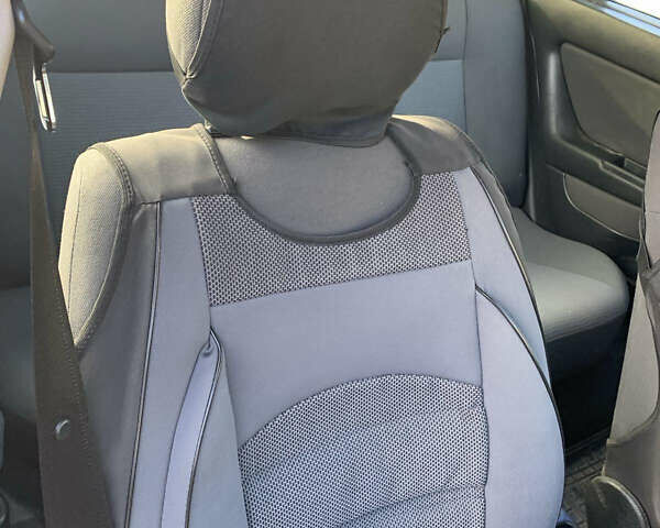 Черный Опель Астра, объемом двигателя 1.4 л и пробегом 216 тыс. км за 3500 $, фото 7 на Automoto.ua