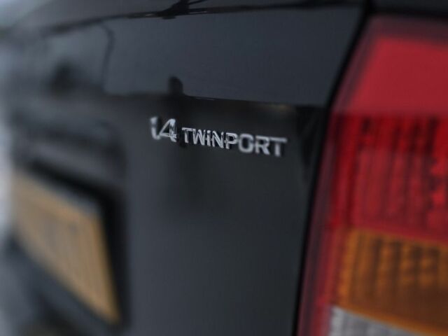 Черный Опель Астра, объемом двигателя 1.4 л и пробегом 184 тыс. км за 3900 $, фото 12 на Automoto.ua