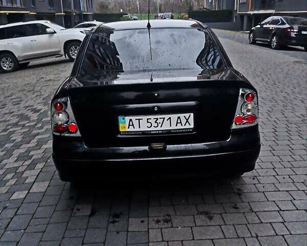 Черный Опель Астра, объемом двигателя 1.39 л и пробегом 214 тыс. км за 1800 $, фото 12 на Automoto.ua