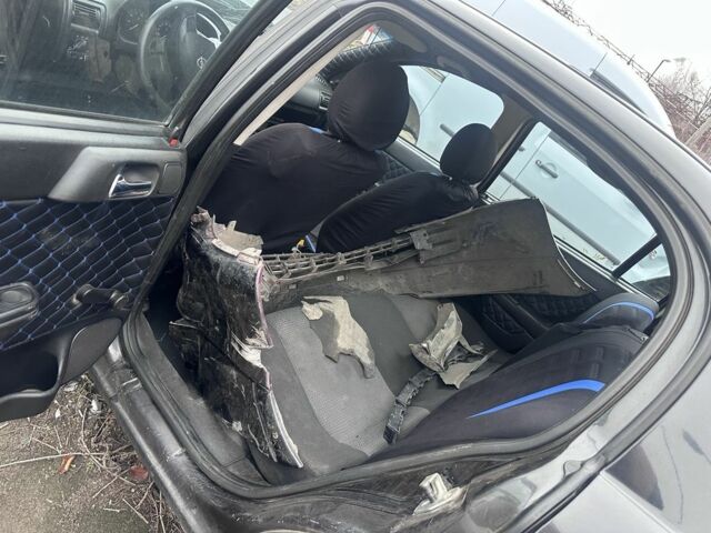 Черный Опель Астра, объемом двигателя 1.4 л и пробегом 150 тыс. км за 900 $, фото 2 на Automoto.ua