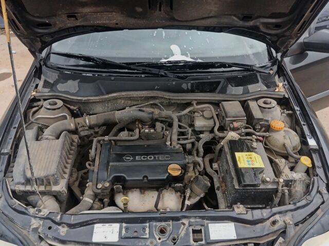 Черный Опель Астра, объемом двигателя 1.4 л и пробегом 214 тыс. км за 1800 $, фото 20 на Automoto.ua