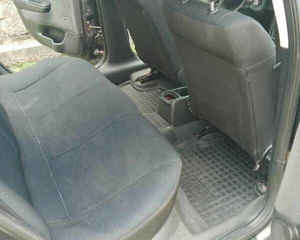 Черный Опель Астра, объемом двигателя 1.4 л и пробегом 243 тыс. км за 3200 $, фото 1 на Automoto.ua