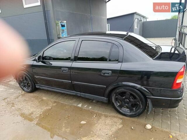 Черный Опель Астра, объемом двигателя 1.6 л и пробегом 147 тыс. км за 2700 $, фото 26 на Automoto.ua