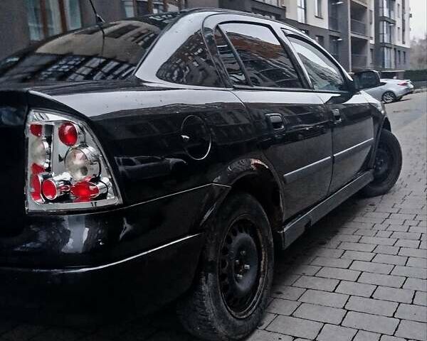 Черный Опель Астра, объемом двигателя 1.39 л и пробегом 214 тыс. км за 1800 $, фото 13 на Automoto.ua