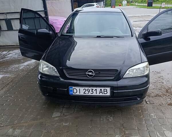 Черный Опель Астра, объемом двигателя 1.6 л и пробегом 147 тыс. км за 2700 $, фото 22 на Automoto.ua