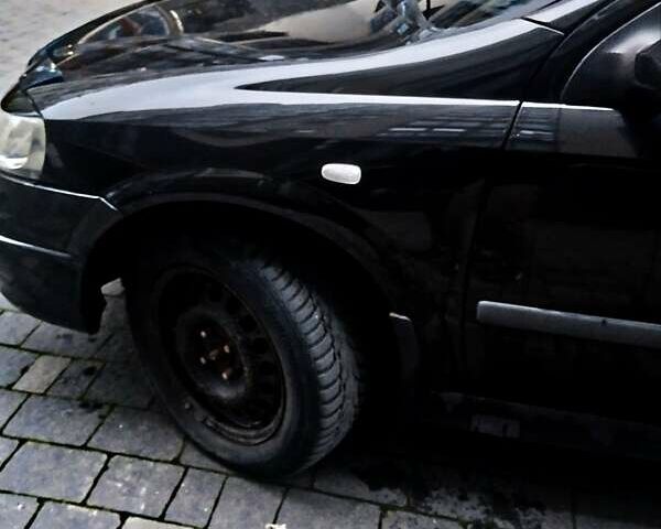 Черный Опель Астра, объемом двигателя 1.39 л и пробегом 214 тыс. км за 1800 $, фото 11 на Automoto.ua