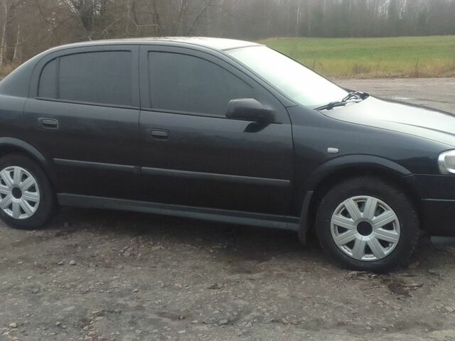 Черный Опель Астра, объемом двигателя 1.4 л и пробегом 351 тыс. км за 3333 $, фото 7 на Automoto.ua