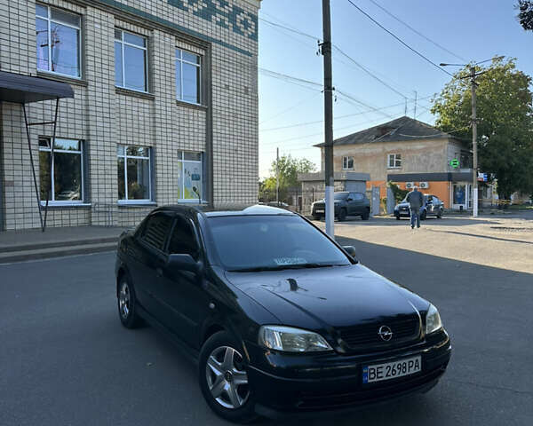 Черный Опель Астра, объемом двигателя 1.4 л и пробегом 212 тыс. км за 4200 $, фото 1 на Automoto.ua