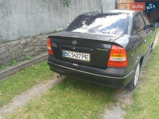 Черный Опель Астра, объемом двигателя 1.4 л и пробегом 243 тыс. км за 3200 $, фото 6 на Automoto.ua