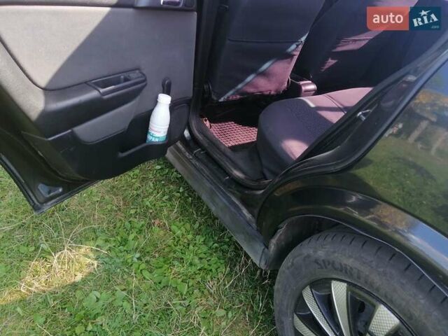 Черный Опель Астра, объемом двигателя 1.4 л и пробегом 250 тыс. км за 3000 $, фото 6 на Automoto.ua