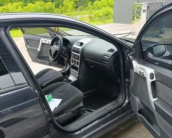 Черный Опель Астра, объемом двигателя 1.6 л и пробегом 147 тыс. км за 2700 $, фото 27 на Automoto.ua