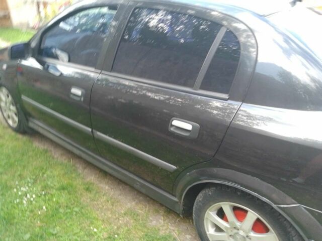 Черный Опель Астра, объемом двигателя 1.4 л и пробегом 243 тыс. км за 3200 $, фото 6 на Automoto.ua