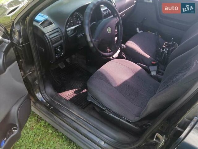 Черный Опель Астра, объемом двигателя 1.4 л и пробегом 250 тыс. км за 3000 $, фото 3 на Automoto.ua