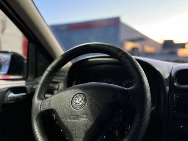 Черный Опель Астра, объемом двигателя 1.4 л и пробегом 215 тыс. км за 3500 $, фото 10 на Automoto.ua