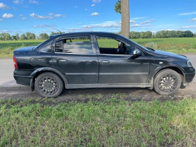 Черный Опель Астра, объемом двигателя 1.4 л и пробегом 294 тыс. км за 3800 $, фото 2 на Automoto.ua